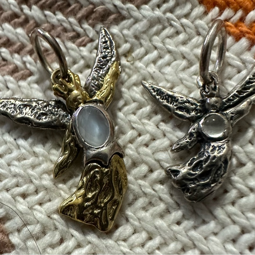 Waxing Poetic angel charms.